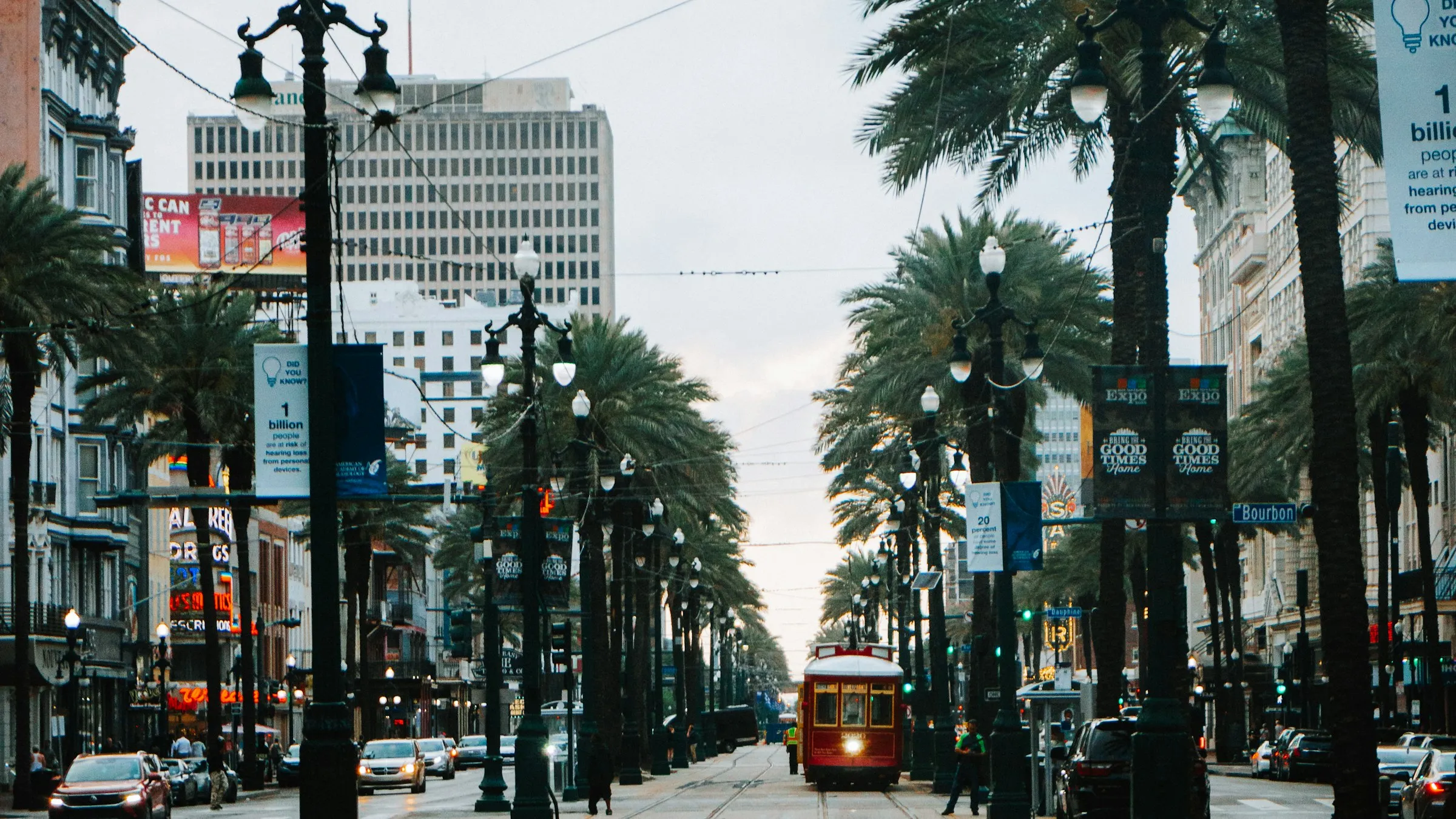 A streetcar on Canal Street in New Orleans at dusk
